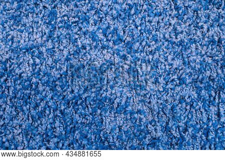 Texture Of Blue Fabric Carpet With Long Pile Close-up. Fluffy Blue Frieze Fur Carpet Texture.