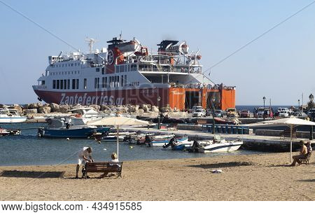 Sikinos Island - Greece - September 2 2019 :  Ferry Boat At Dock In Small Harbor Of Aloprina Passeng