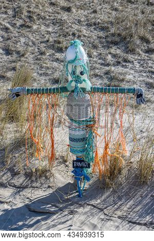 Petten Aan Zee, Noord-holland, Netherlands. April 17, 2021. Rope Boy At The Wall Of Shame, An Open-a
