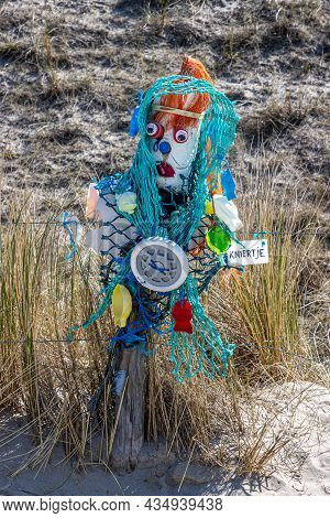 Petten Aan Zee, Noord-holland, Netherlands. April 17, 2021. Kniertje At The Wall Of Shame, An Open-a