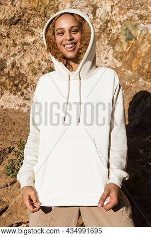 Beautiful woman in white hoodie winter fashion