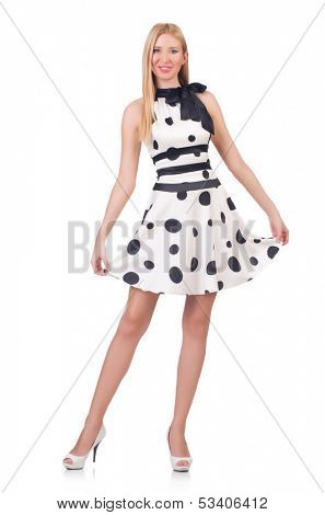 Tall model dressed in dress with polka dosts on white
