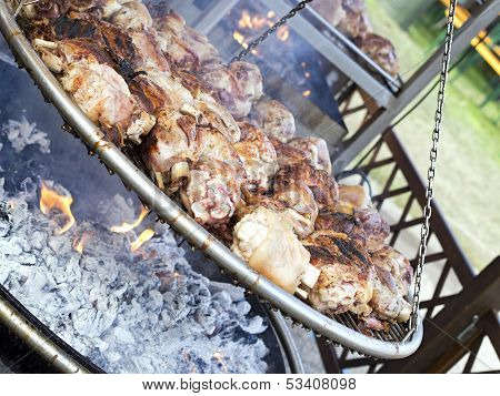 Roasted Pork Knuckle  On    Brazier In Country Fair