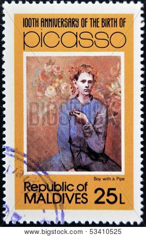 stamp printed in Malldives Islands shows boy with a pipe by Pablo Ruiz Picasso