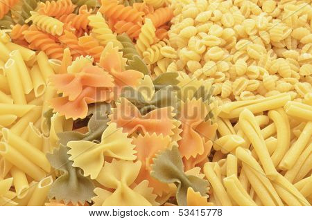 A closeup of three types of colored pasta