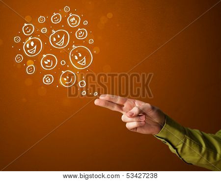 Group of happy hand drawed smiley faces coming out of gun shaped hands