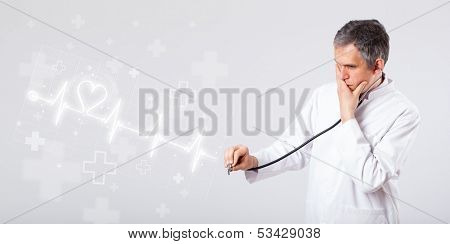 Proffesional doctor examinates heartbeat with abstract heart