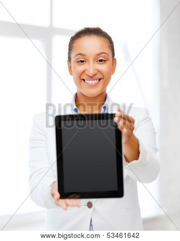 office, business, technology and internet concept - businesswoman with tablet pc in office