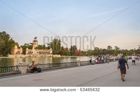 People walking in Buen Retiro park lake, Madrid