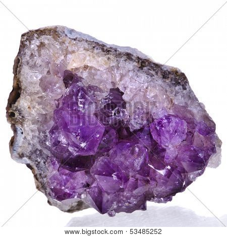 Beautiful amethyst druse close up isolated on white background - semiprecious gem used for jewels 