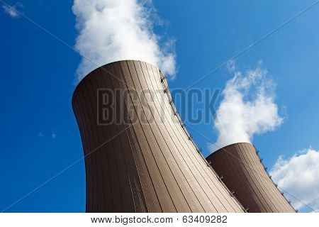 Cooling Towers Of A  Nuclear Power Plant Against Sky And Clouds