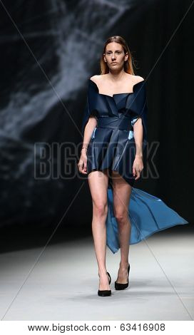 ZAGREB, CROATIA - APRIL 10 : Fashion model wears clothes made by Petra Vuletic and Sasa Hortig on 