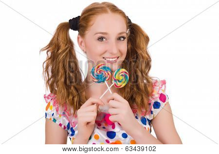 Redhead young girl with lolipops isolated on white