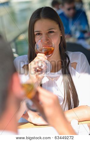 happy young couple having lanch at beautiful restaurant on by the sea on  beach