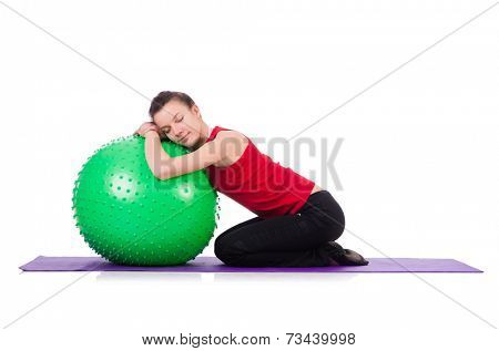 Young woman exercising with swiss ball