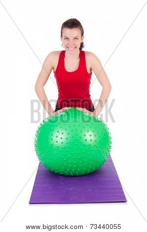 Young woman exercising with swiss ball