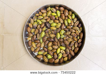 A plate filled with Chebulic Myrobalan on an isolated background