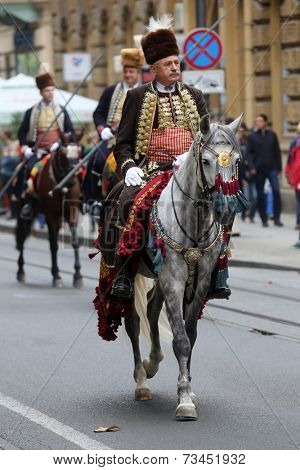 ZAGREB, CROATIA - OCTOBER 04: The parade of 70 participants, thirty horses and forty members of a brass band to the main square were announced next, 300th Sinjska Alka, on October 04, 2014 in Zagreb.