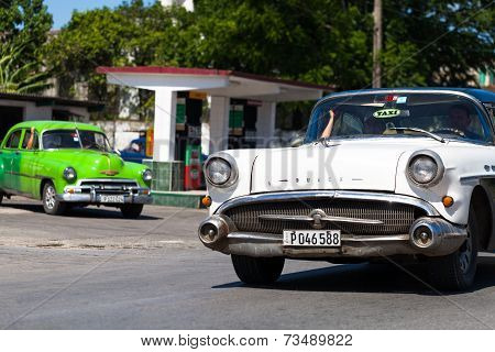 HAVANA,CUBA - June 27, 2014: White and green classic car on the road in havana