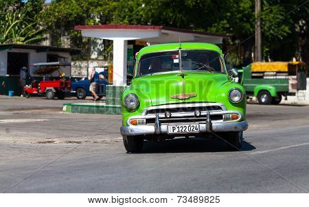 HAVANA,CUBA - June 27, 2014: Green classic car on the road in havana