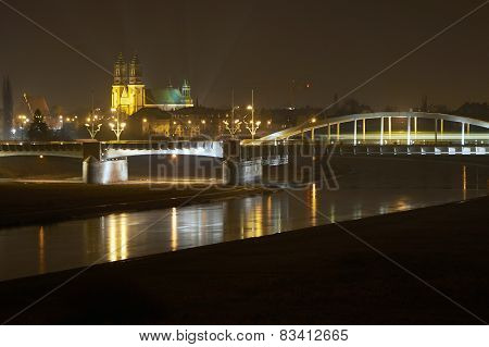 River Warta, bridge and cathedral at night