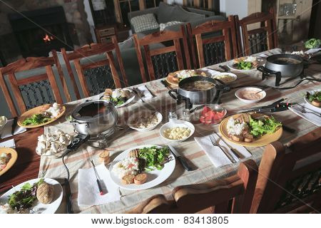 A Fondue Dinner  with Table and Equipement.