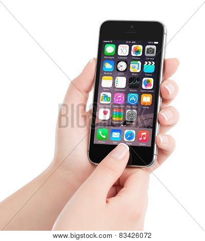 Apple Space Gray Iphone 5S With Ios 8 Homescreen On The Display In Female Hand, Designed By Apple In