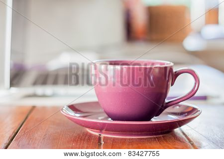 Purple Coffee Cup On Work Station