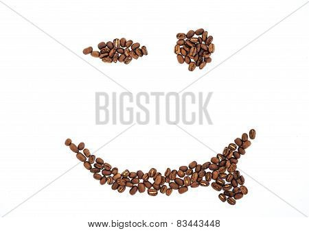 Grains of coffee in the form of smiling face isolated. coffee beans isolated on white background. ro