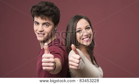 Happy Young Couple Thumbs Up