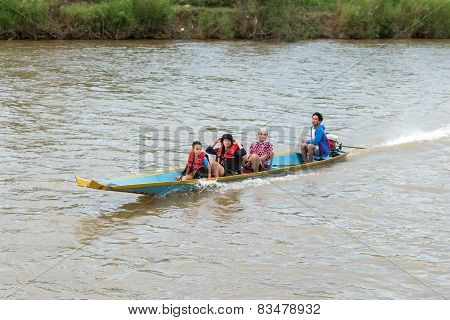 Vang Vieng, Lao P.d.r. - October 24 : Unidentified Tourists Are Rowing Kayak Boats In Song River On