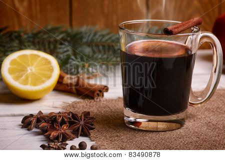 Mulled wine, punch and spices for glintwine on wooden background