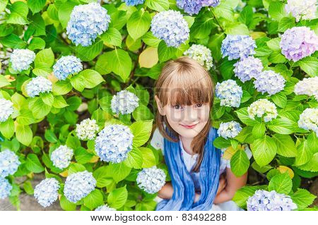 Little girl playing with flowers