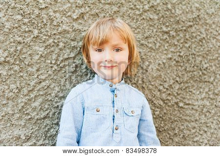 Outdoor portrait of a cute little boy