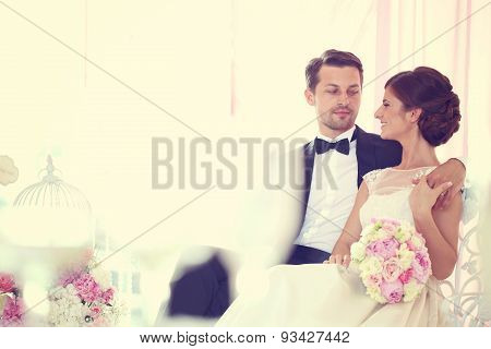 Bride And Groom Surrounded By Flowers