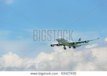 HONG KONG - JUNE 04, 2015: Cathay Pacific aircraft landing. Cathay Pacific is the flag carrier airline of Hong Kong, with its head office and main hub located at Hong Kong International Airport