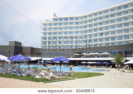 SOCHI, RUSSIA - JUL 25, 2014: Area of the Hotel Radisson Blu Paradise Resort and Spa with people resting by the pool