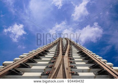 Two Rail Lines Steel Sky Clouds.