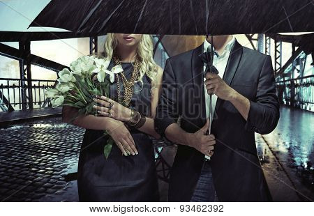 Fashionable couple on night city street