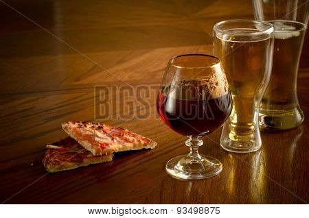 Alcoholic drinks on the table and wooden appetizer , pizza, Apple, wine, beer