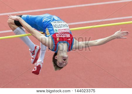 PRAGUE, CZECH REPUBLIC - MARCH 8, 2015: Aleksandr Shustov (#312 Russia) competes in the men's high jump event of the European Athletics Indoor Championship.