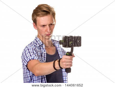 Man Holds Small Action Camera.