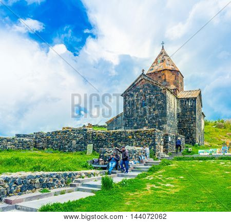 SEVAN ARMENIA - MAY 31 2016: The local painters offers their works next to the Holy Apostles Church of Sevanavank Monastery on May 31 in Sevan