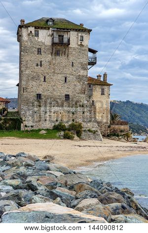 Seascape with Stones Medieval tower in  Ouranopoli, Athos, Chalkidiki, Central Macedonia, Greece