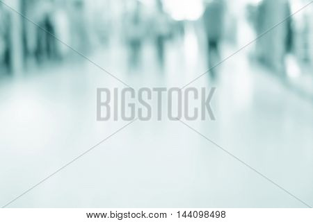 abstract defocused blurred background empty business corridor or shopping mall. Medical and hospital corridor defocused background with modern laboratory (clinic)