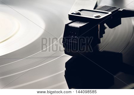 Vinyl player. Spinning record, phono cartridge macro