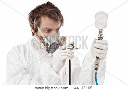 Worker with airbrush gun isolated on white background