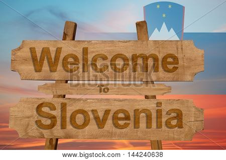 Welcome To Jamaica Sign On Wood Background With Blending National Flag