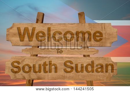 Welcome To Jamaica Sign On Wood Background With Blending National Flag