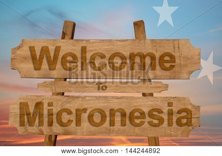 Welcome To Jamaica Sign On Wood Background With Blending National Flag